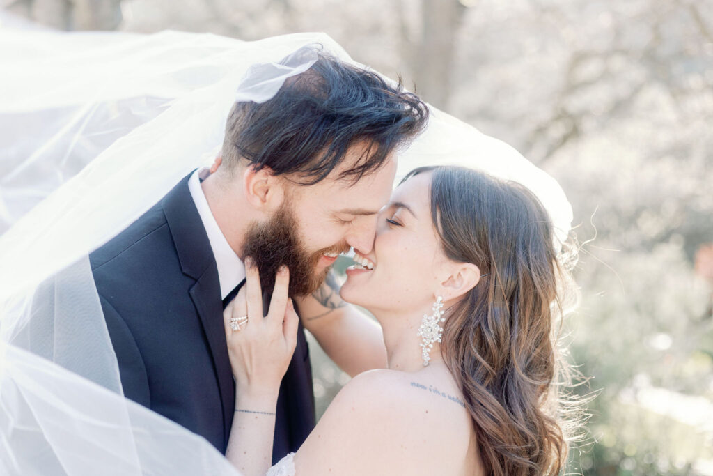Bay Area photographer captures bride and groom kissing during portraits