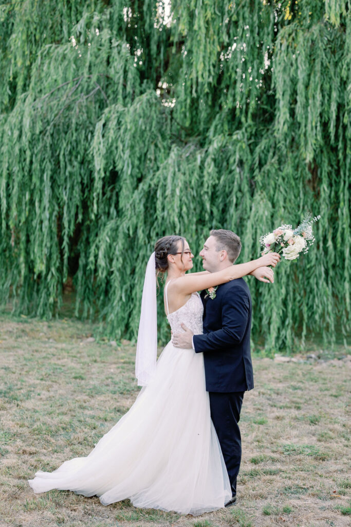 Bay Area photographer captures bride and groom standing in front of tree