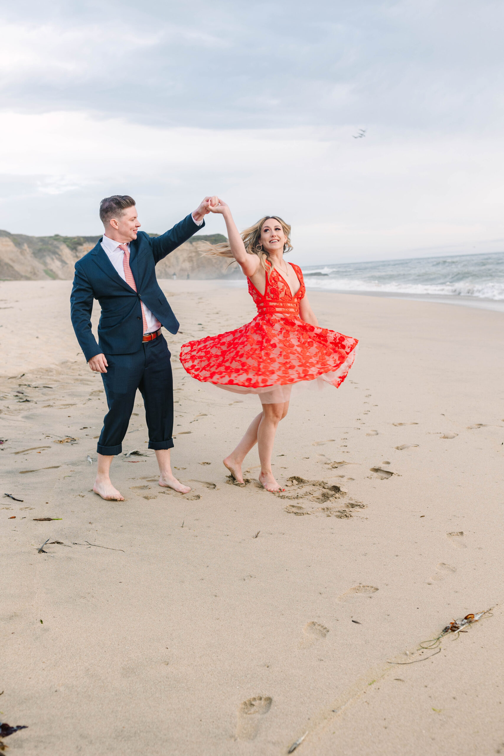 Bay Area wedding photographers capture man spinning woman on beach