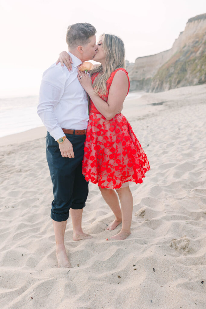 Bay Area wedding photographers capture couple kissing on beach at Half Moon Bay