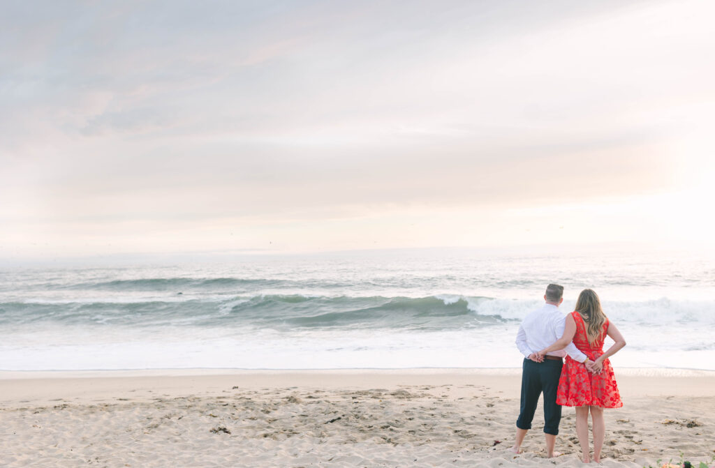Bay Area wedding photographers capture couple standing along the water at Half Moon Bay