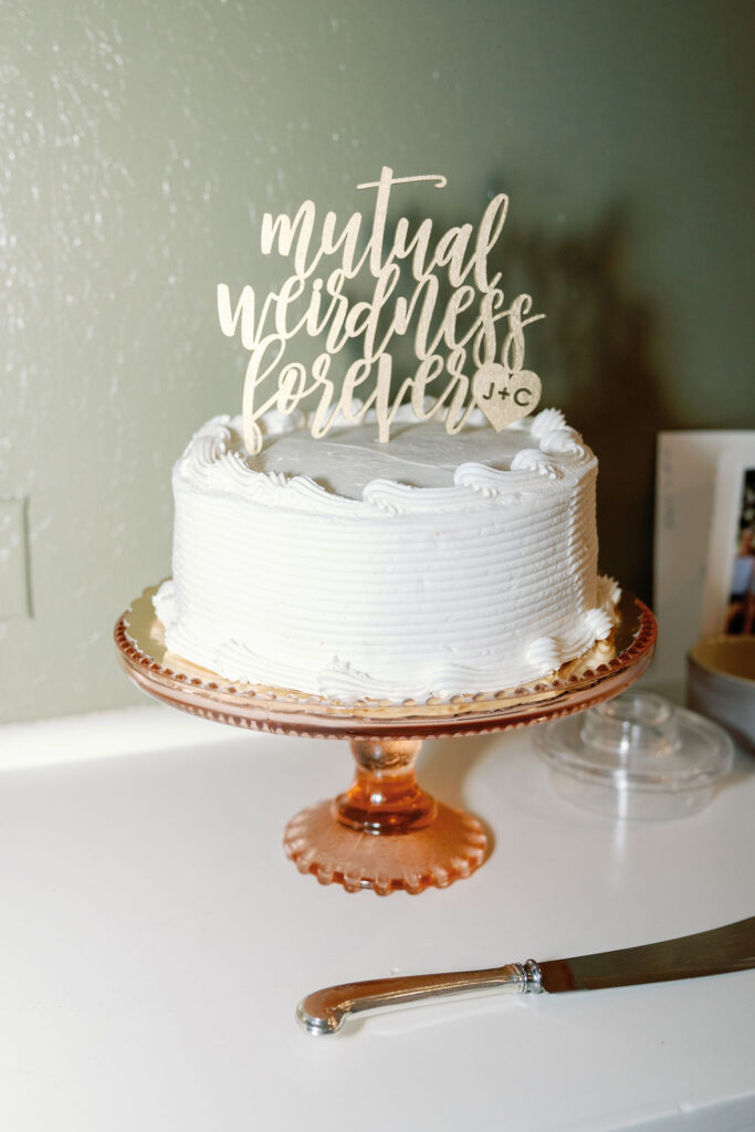 Bay Area wedding photographer captures wedding cake with topper 