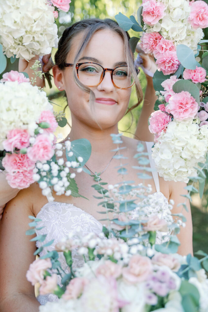 Bay Area wedding photographer captures bride being surrounded by pink bouquets