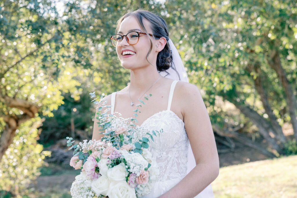 Bay Area wedding photographer captures bride holding bouquet walking 
