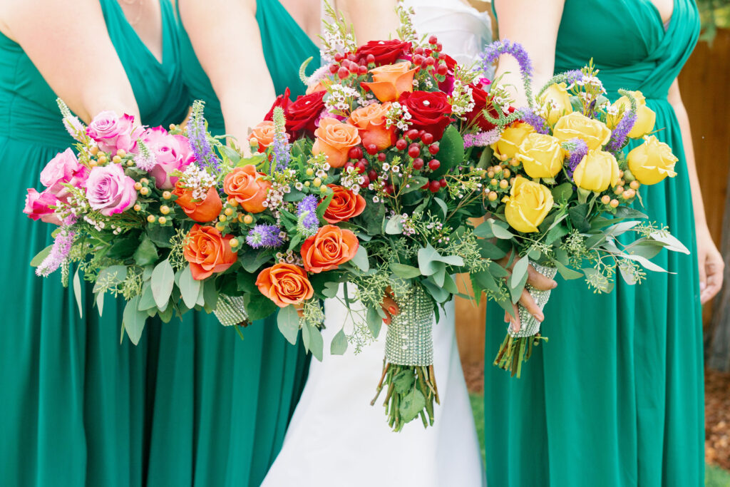 Bay Area wedding photographer captures bride and bridesmaids holding bouquets 