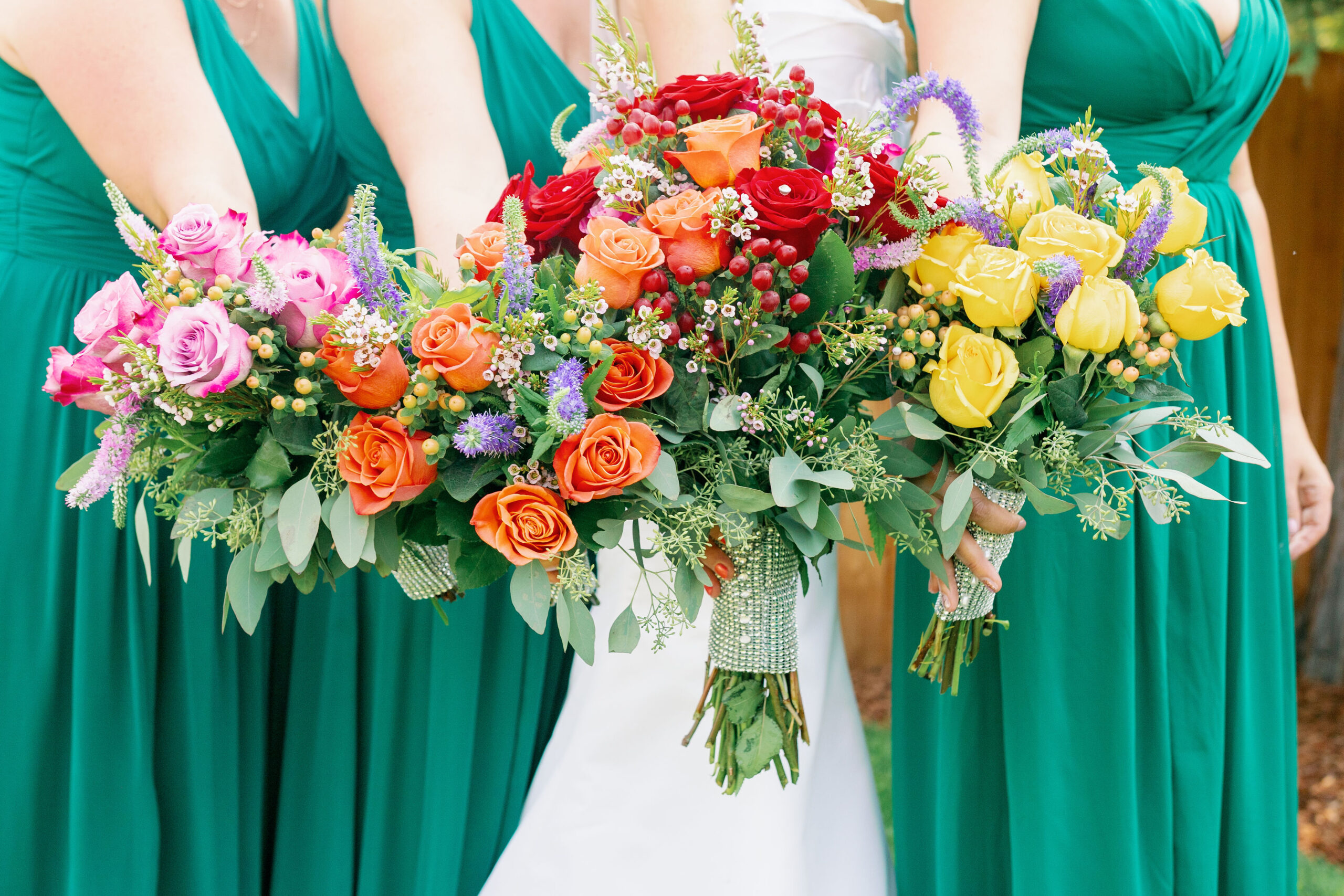 Bay Area wedding photographer captures bride and bridesmaids holding bouquets