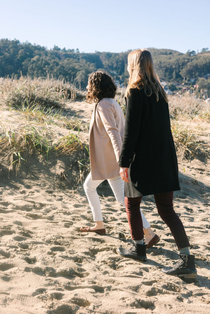 Bay Area photographer captures couple holding hands on beach