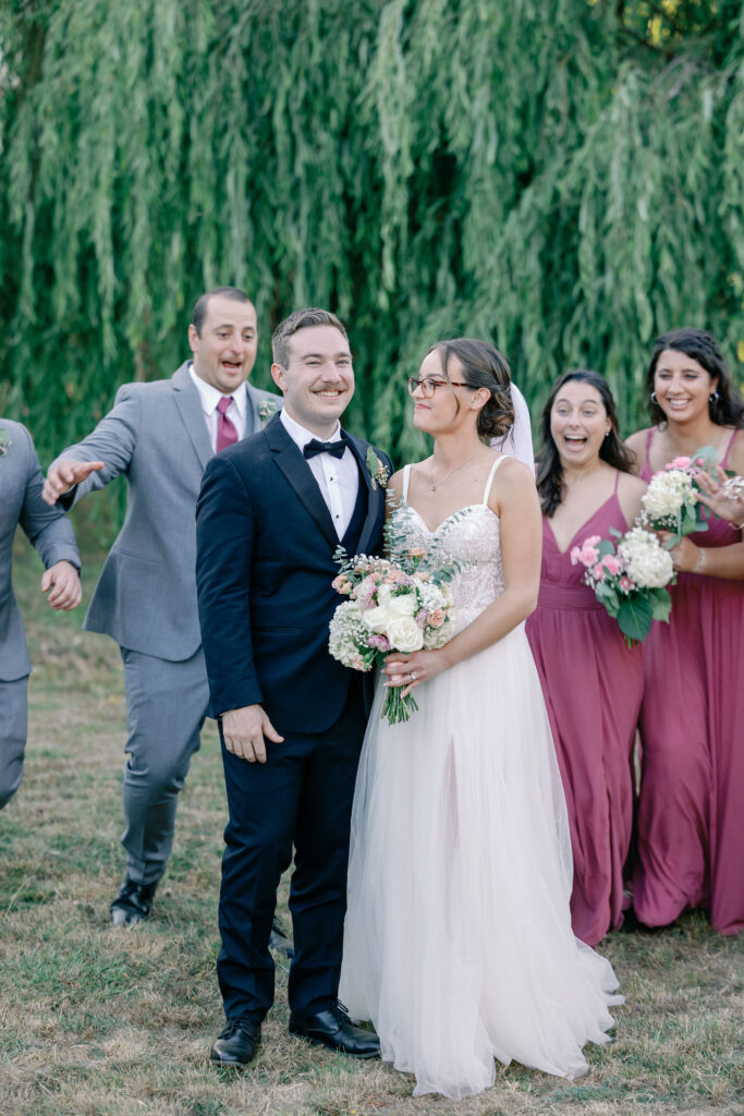 Bay Area photographer captures bride and groom standing together with wedding party