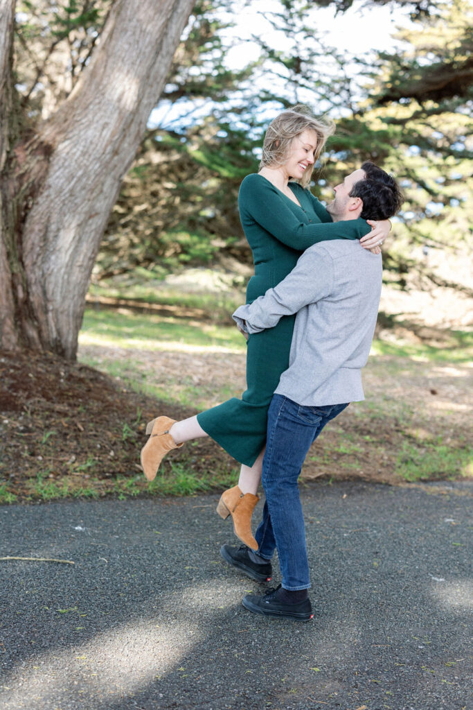 Bay Area wedding photographer captures man lifting woman and swinging her around
