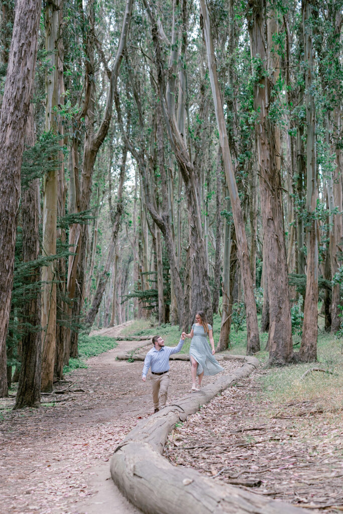 Bay Area wedding photographer captures man and woman walking in forest together