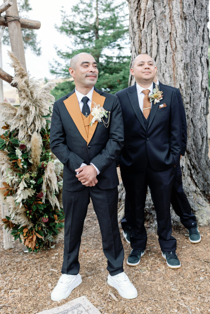 Bay Area wedding photographer captures groom standing withe groomsmen before seeing bride for first time