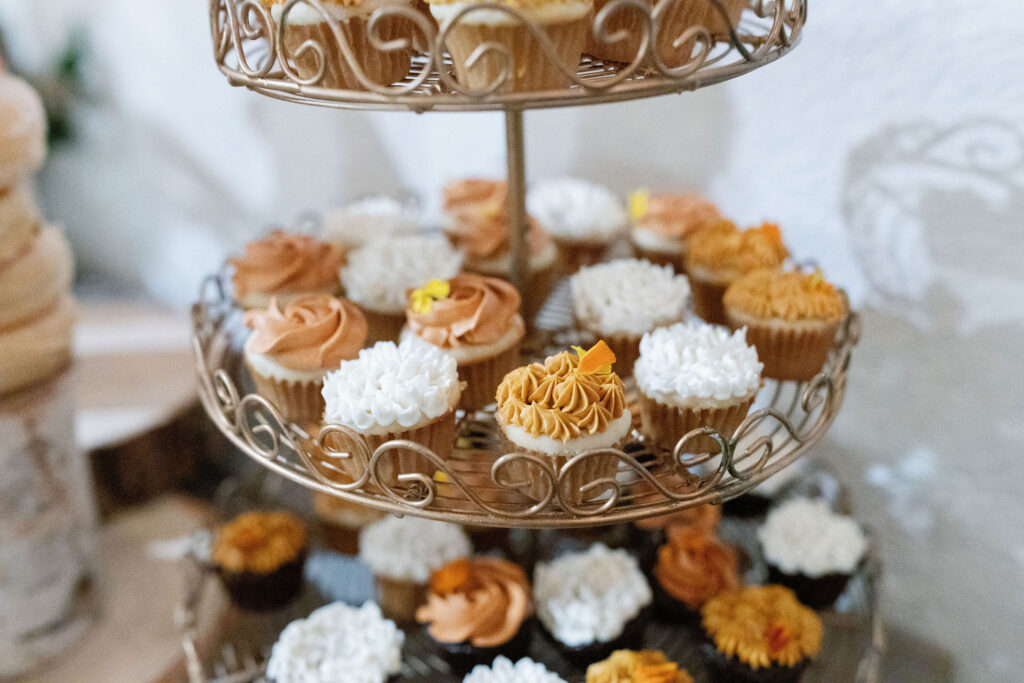 Bay Area wedding photographer captures cupcakes on tiers at private event made by best bakery in bay area