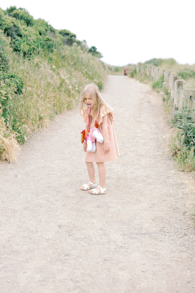 Bay Area wedding photographer captures young girl walking on beach