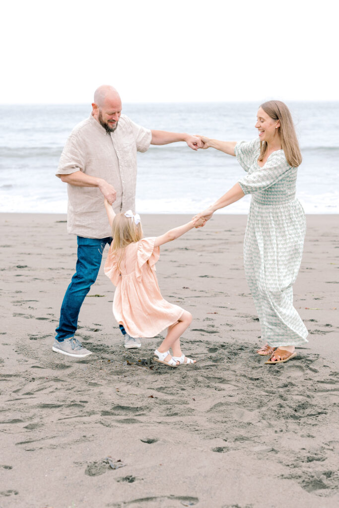 Bay Area wedding photographer captures family playing in sand together