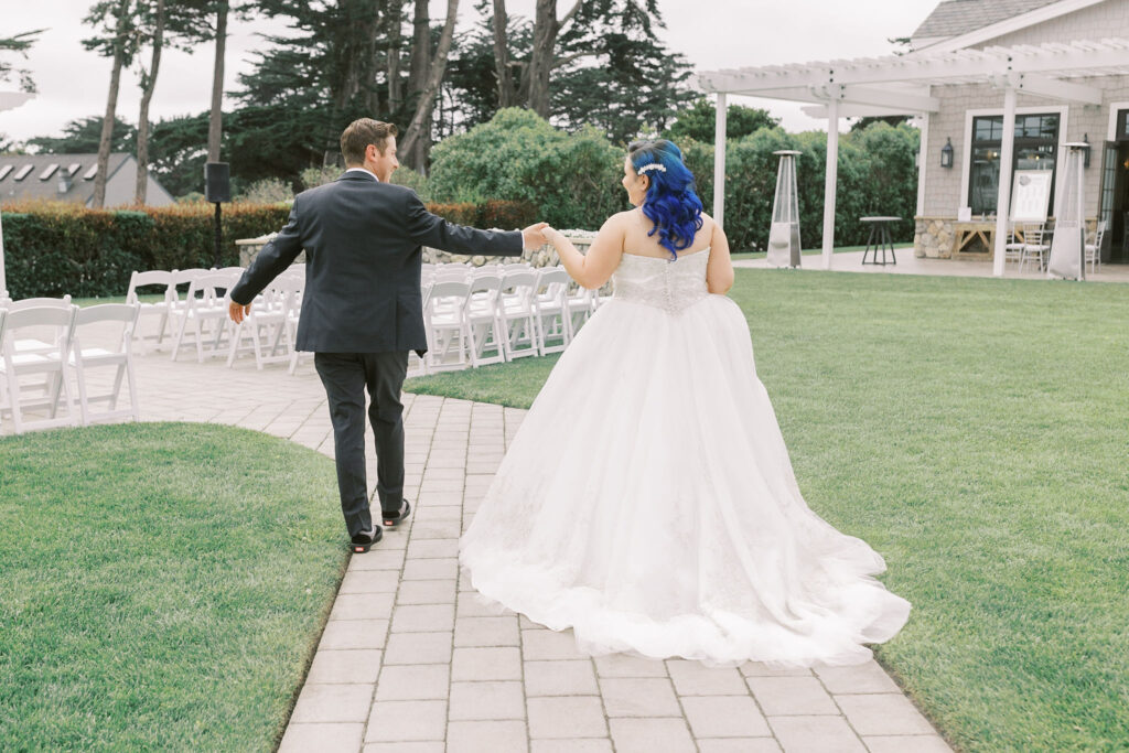 Sacramento wedding photographer captures bride and groom walking together to ceremony