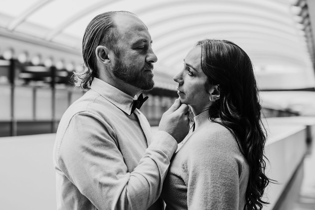 Bay Area wedding photographer captures groom holding bride's chin in black and white portrait