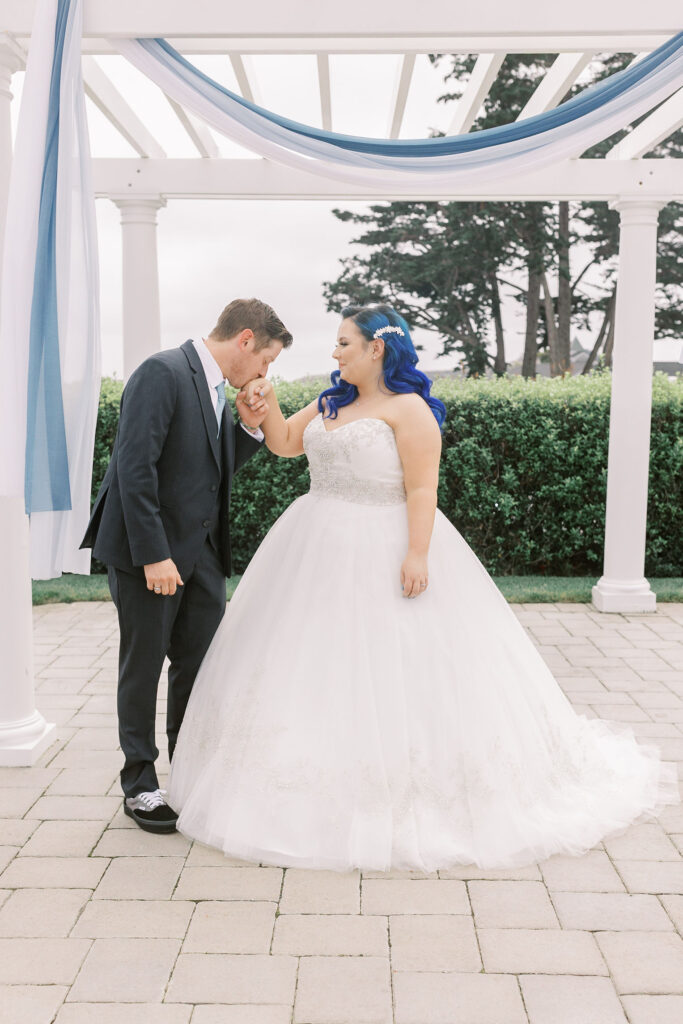 Sacramento wedding photographer captures groom kissing bride's hand