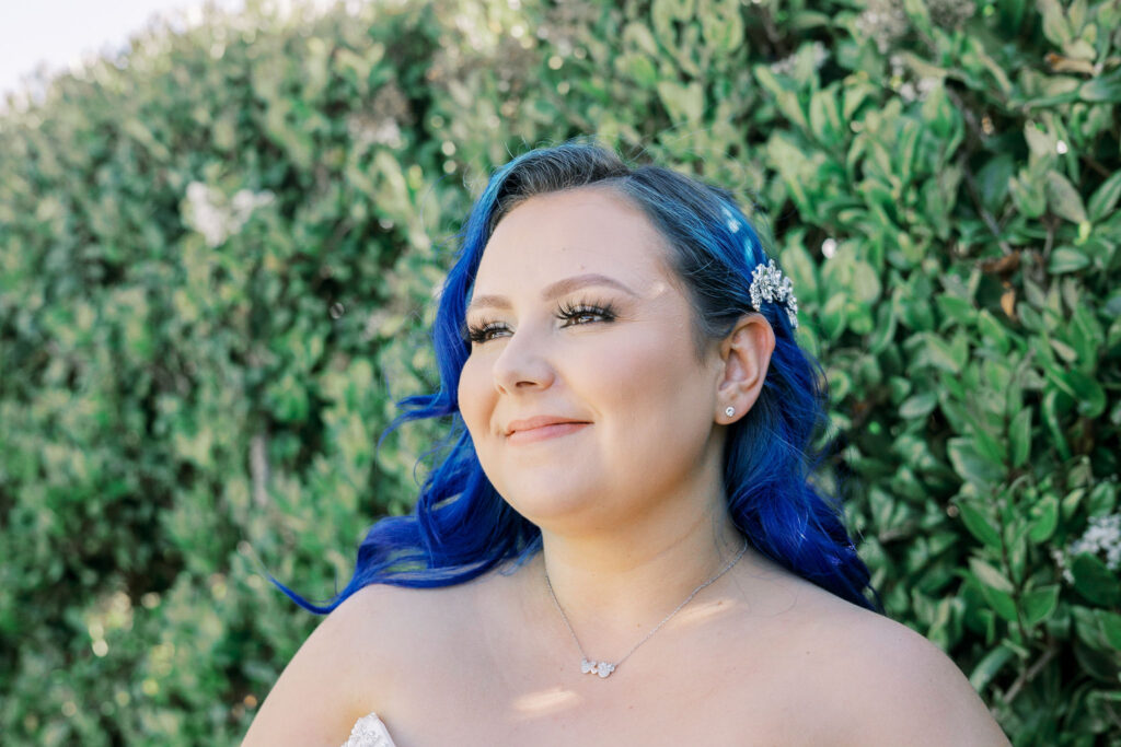 Sacramento wedding photographer captures bride with blue hair smiling