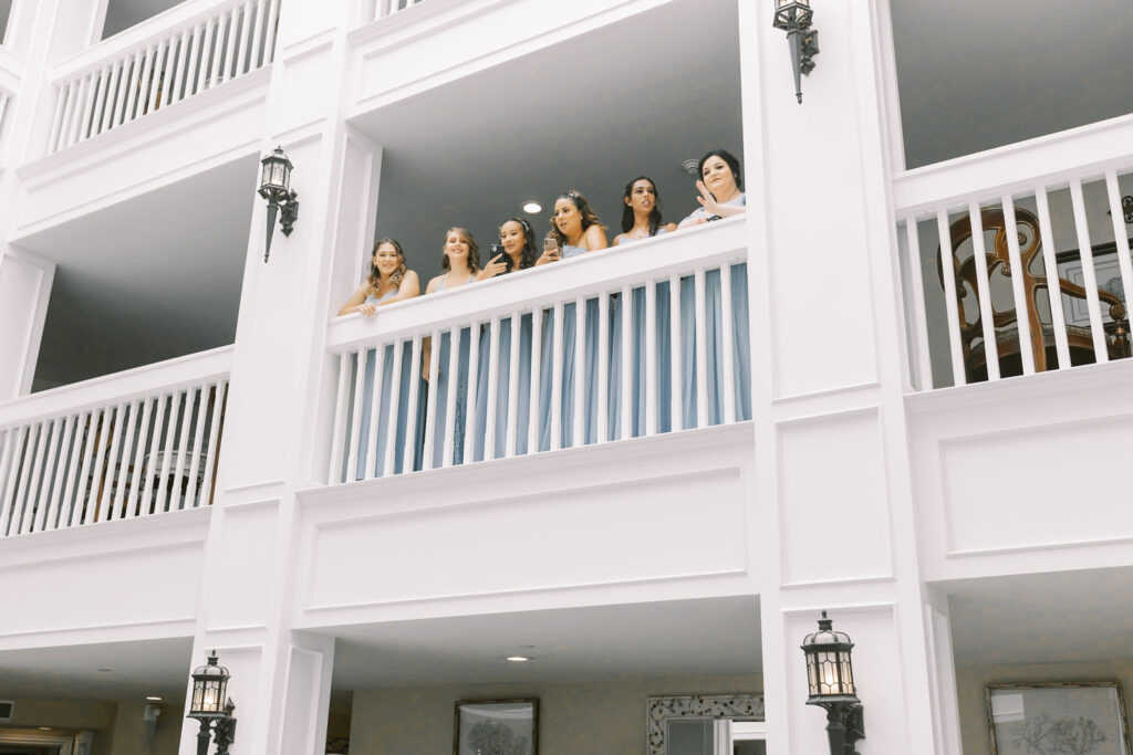 Sacramento wedding photographer captures bridesmaids on balcony