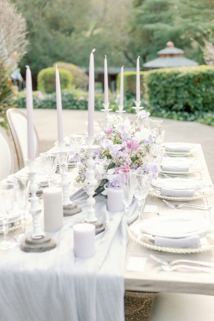 Bay Area wedding photographer captures table setting for backyard wedding with cream and white elements for elegant feel