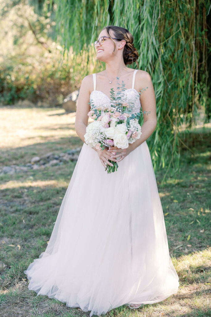 Bay Area wedding photographer captures bride in wedding dress holding bouquet