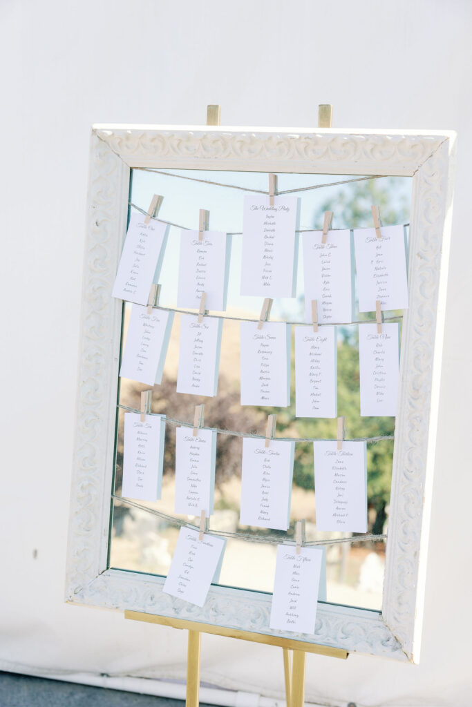 Bay Area wedding photographer captures white frame with seating chart