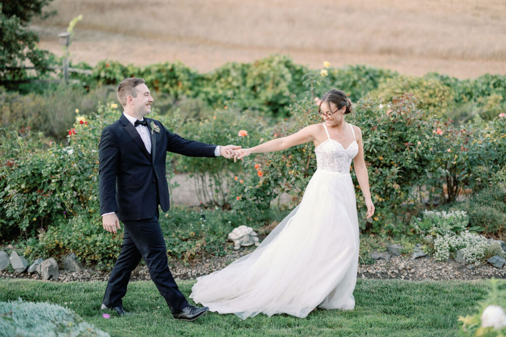 Bay Area wedding photographer captures bride and groom walking hand in hand at Rosewood Events