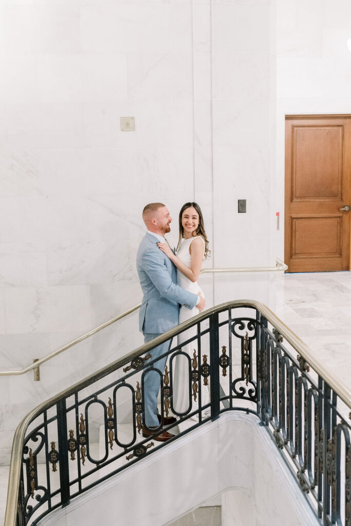 Bay Area wedding photographer captures bride and groom embracing on top of stairs
