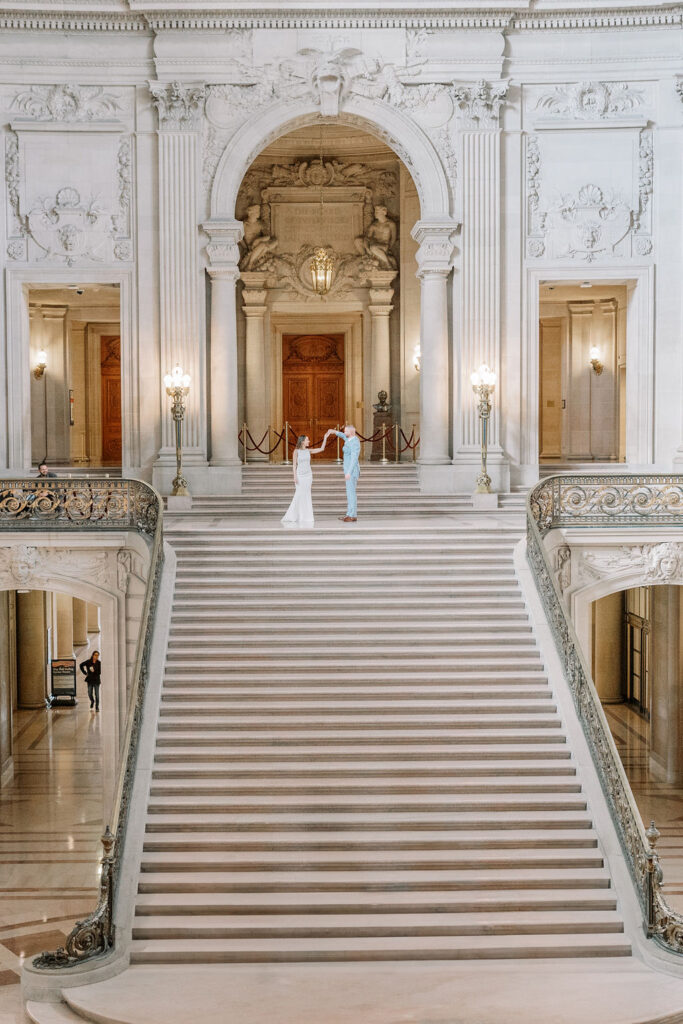 Bay Area wedding photographer captures bride and groom walking up the stairs