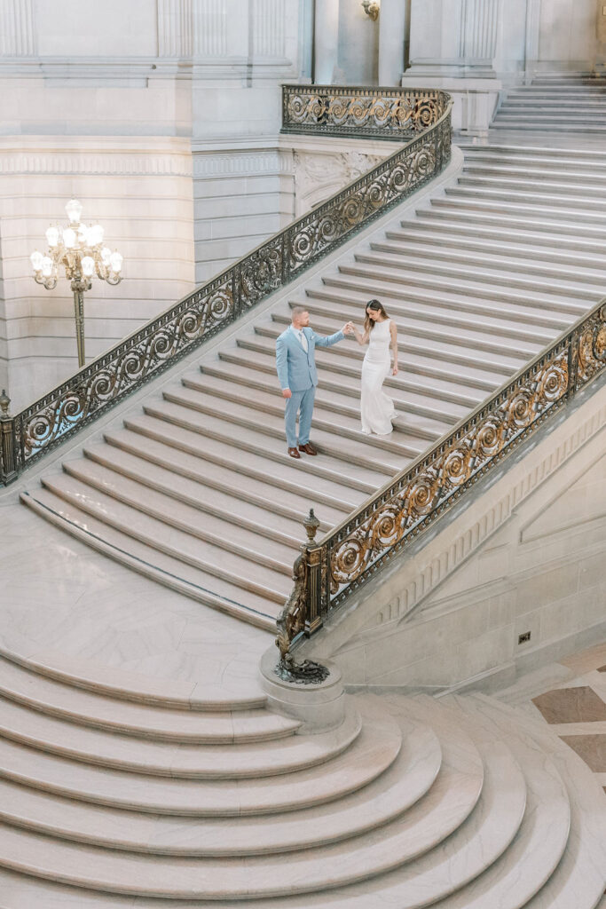 Bay Area wedding photographer captures bride and groom walking down stairs
