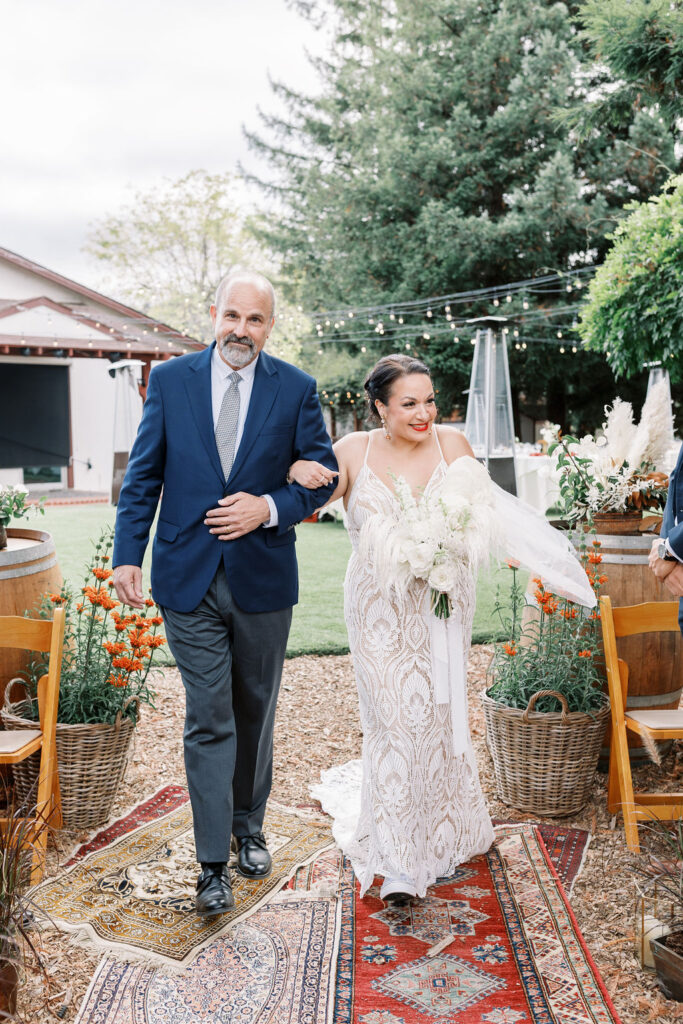 Bay Area wedding photographer captures bride walking down aisle at Rancho Nicasio wedding