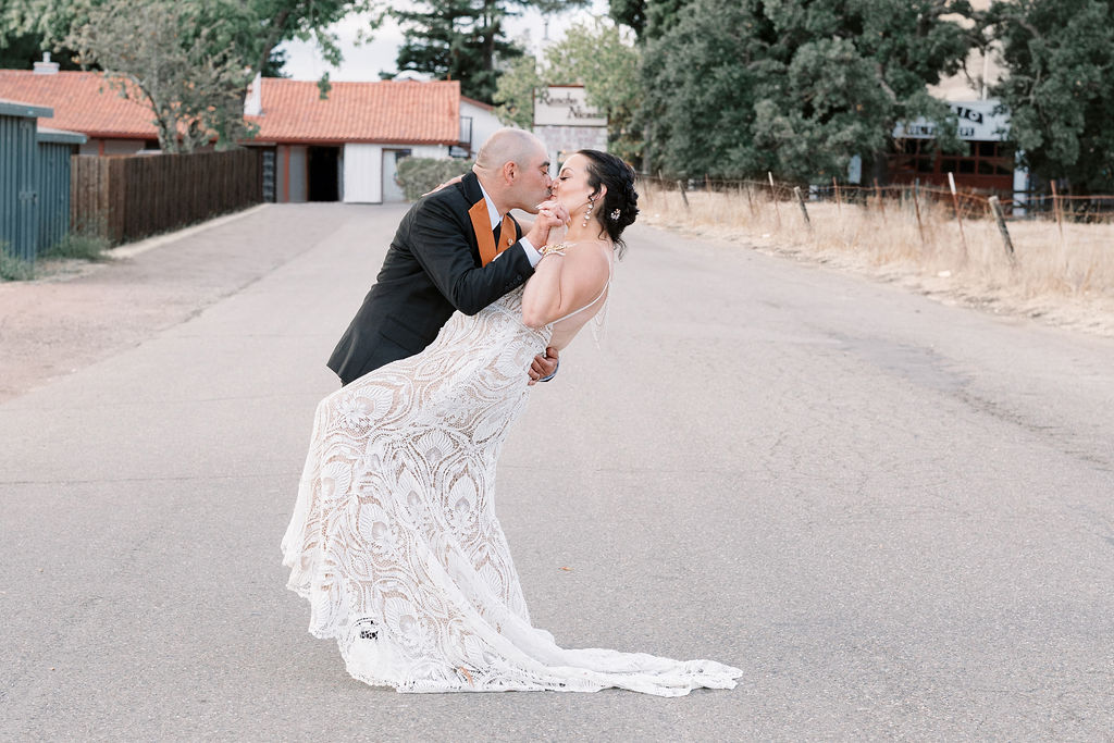 Bay Area wedding photographer captures bride and groom kiss during outdoor bridal portraits