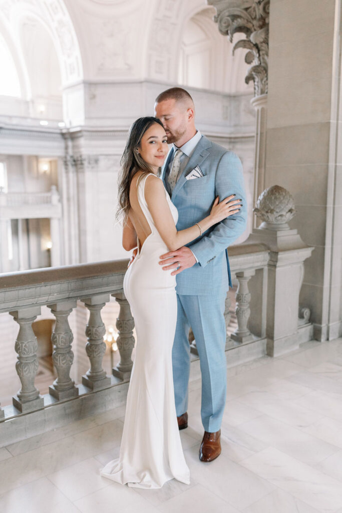 Bay Area wedding photographer captures bride and groom hugging and kissing